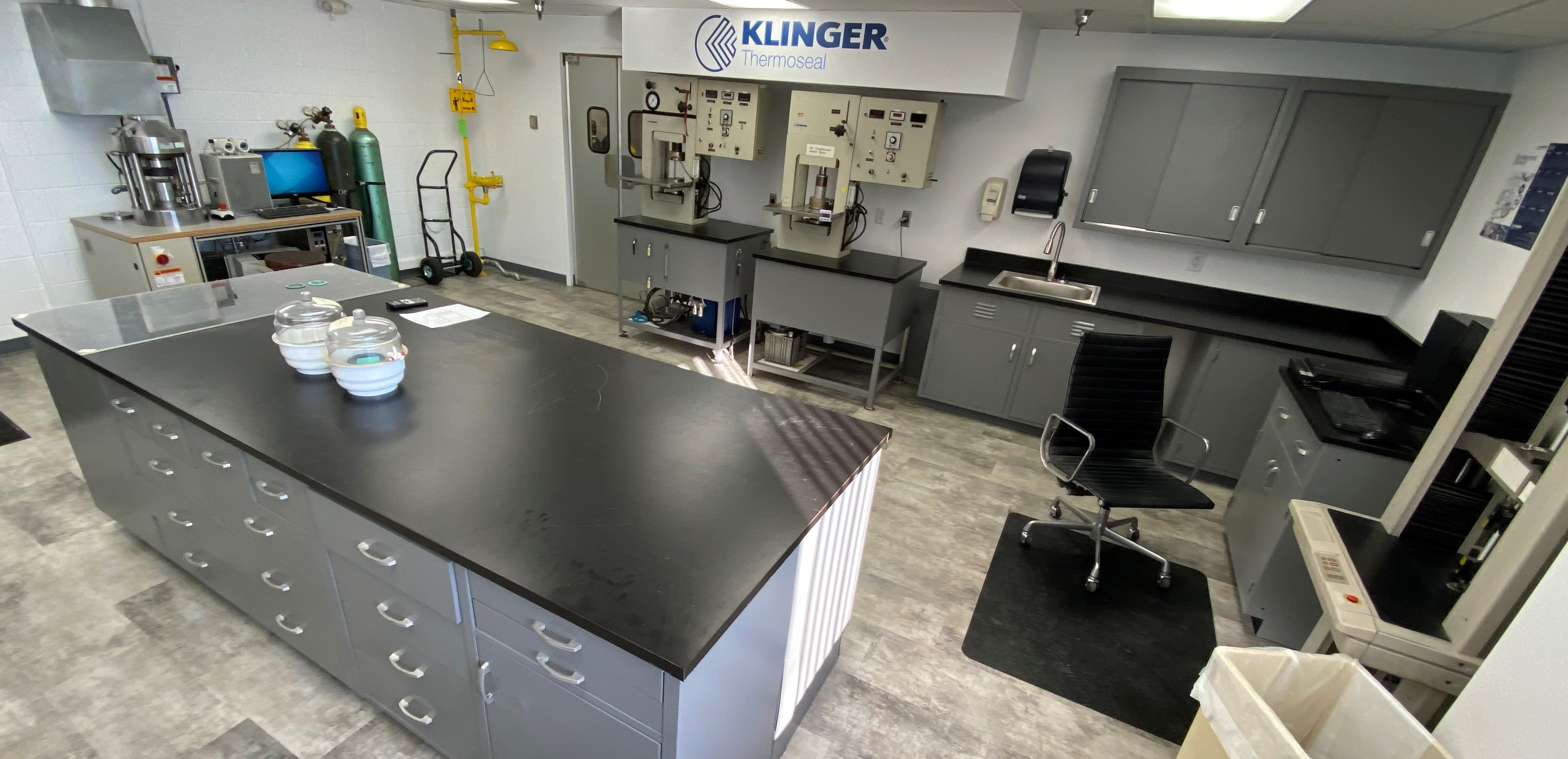 Klinger lab with work desk, chair, and various equipment around the room for use.